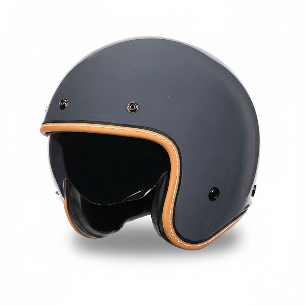 Dark gray motorcycle helmet with brown trim on a white background
