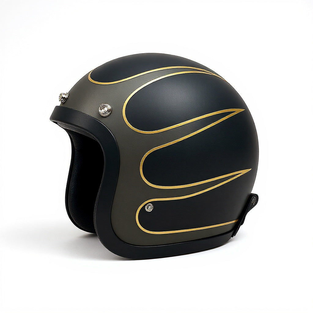 Black motorcycle helmet with gold designs on a white background
