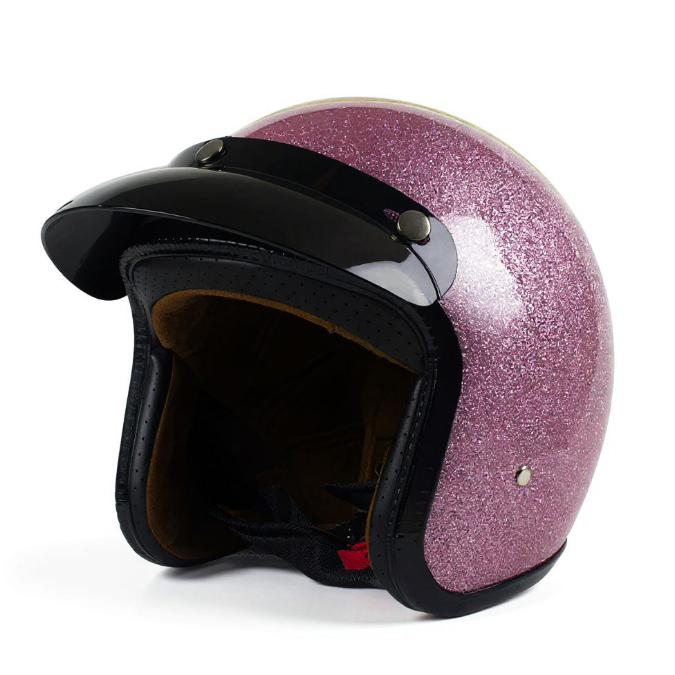 Pink glittery helmet with black visor on a white background
