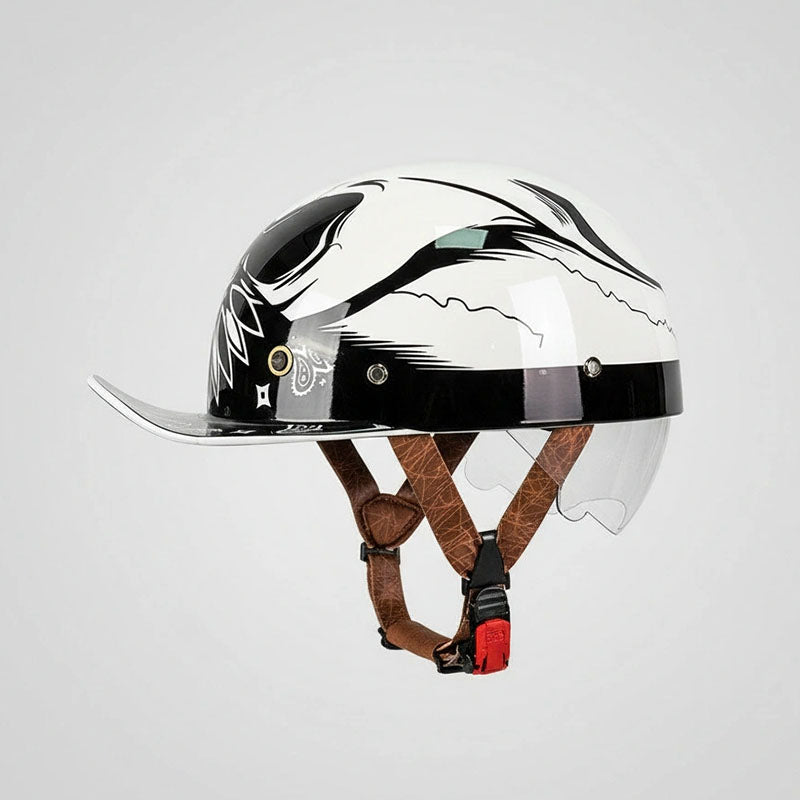Helmet with a clear visor and brown leather chin strap on a light gray background
