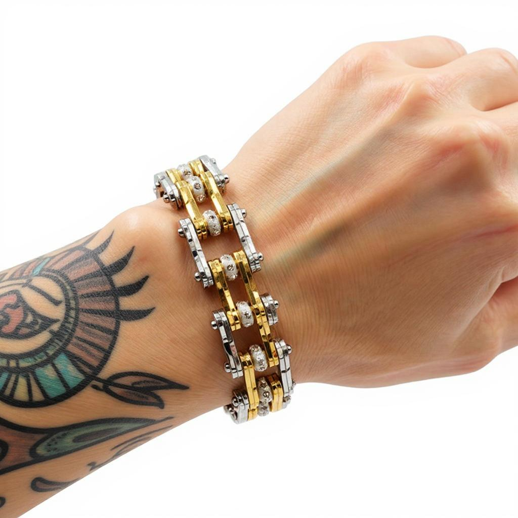 Bracelet on a wrist with a tattoo against a white background