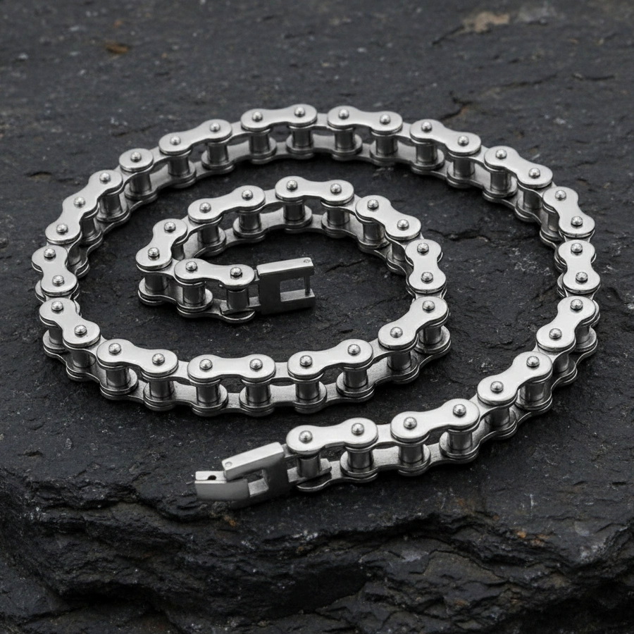 Metallic chain on a dark stone surface