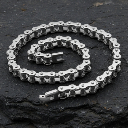 Metallic chain on a dark stone surface