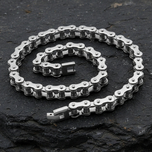 Metallic chain on a dark stone surface