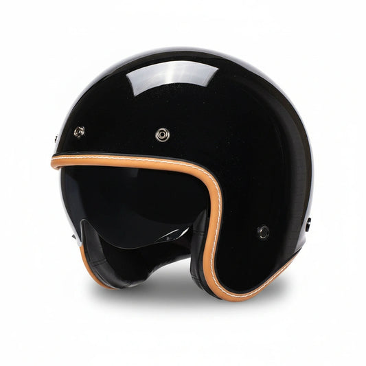Black motorcycle helmet with brown accents on a white background