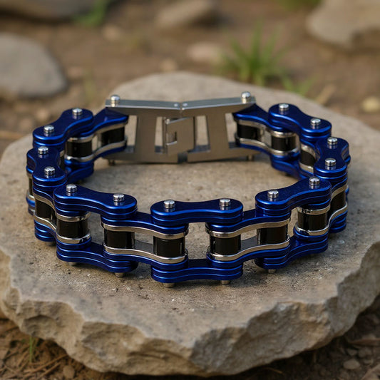 Blue and silver chain bracelet on a stone surface with a natural background