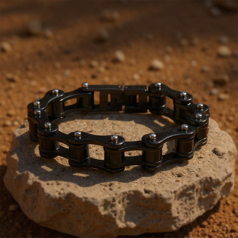 Black chain bracelet on a rock with a natural background