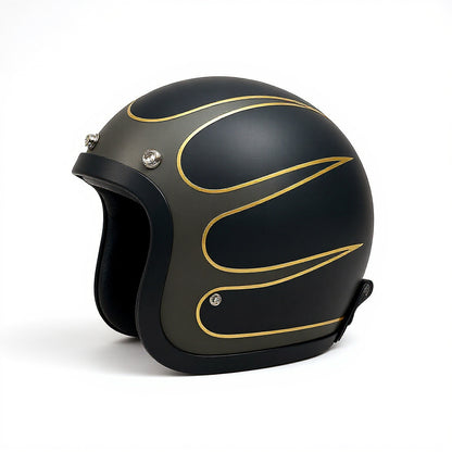 Black motorcycle helmet with gold designs on a white background