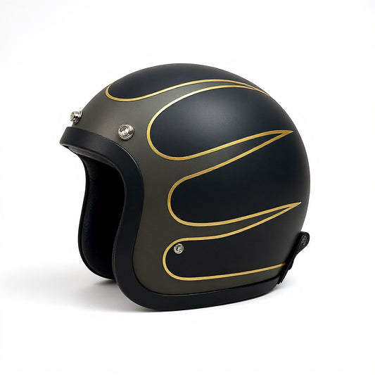 Black motorcycle helmet with gold designs on a white background