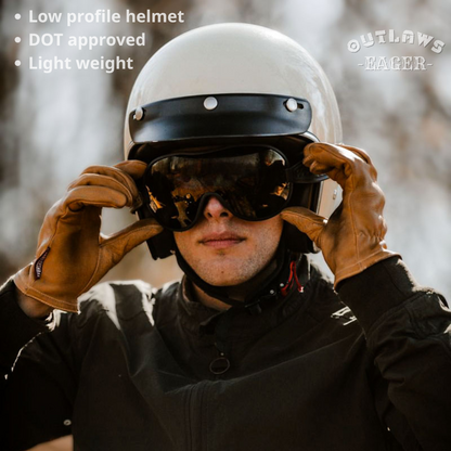 Person wearing a white helmet and sunglasses with text about helmet features and brand name.