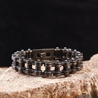 Metal chain bracelet on a stone surface with a dark background